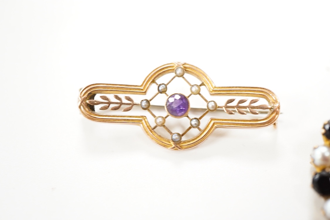 A Victorian 15ct and diamond set navette shaped Etruscan style brooch (lacking pin), 46mm, gross weight 3.5 grams, a 9ct, amethyst and seed pearl set bar brooch and a 9ct, garnet and split pearl set wreath brooch, gross